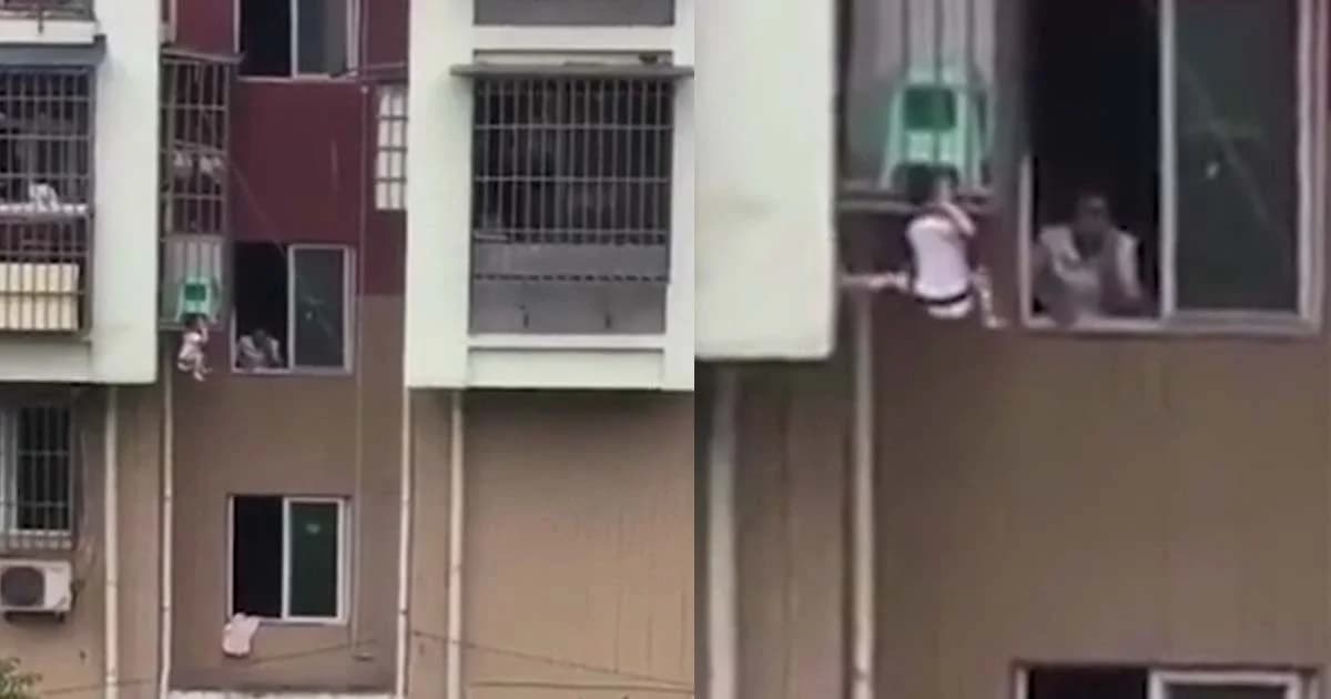 เด็กจีนซุกซน ปีนหน้าต่างหัวติดราวเหล็ก-ขาห้อยต่องแต่ง