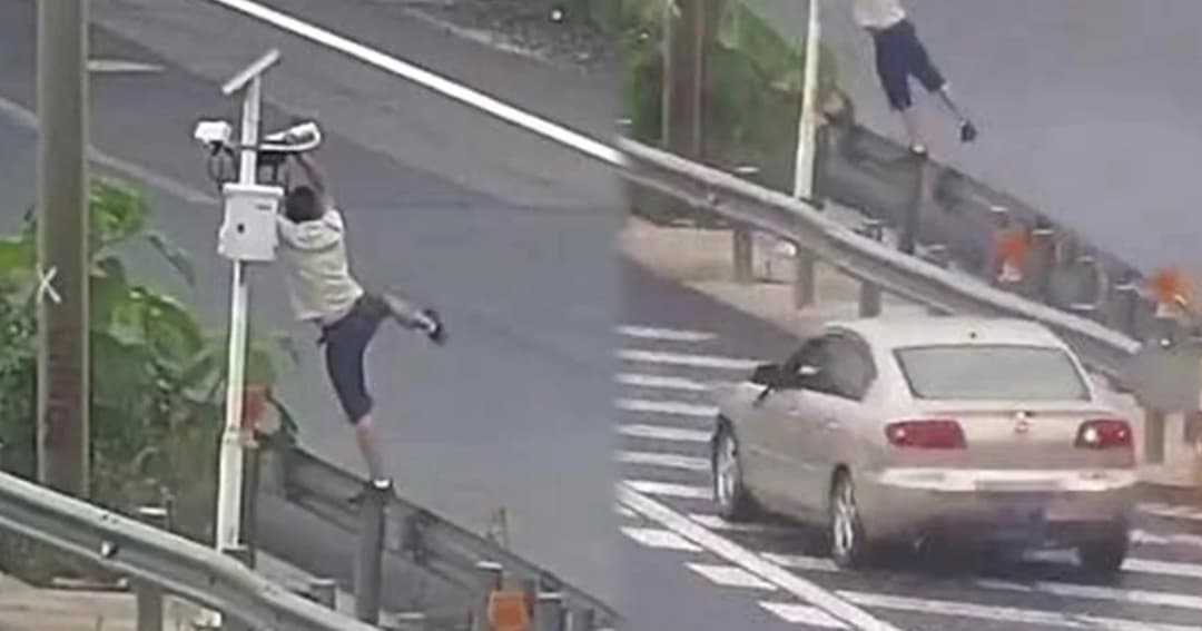 หลบไม่พ้น หนุ่มจีนยืดสุดแขนเอากระเป๋าบังวงจรปิด ขณะทำผิดกฎจราจร