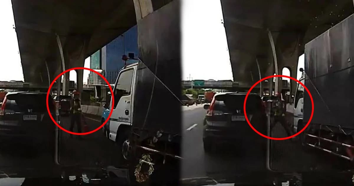 เฉียดแค่หน้า! ตร. ตั้งกรวยกลางถนน หวิดโดนรถบรรทุกชน