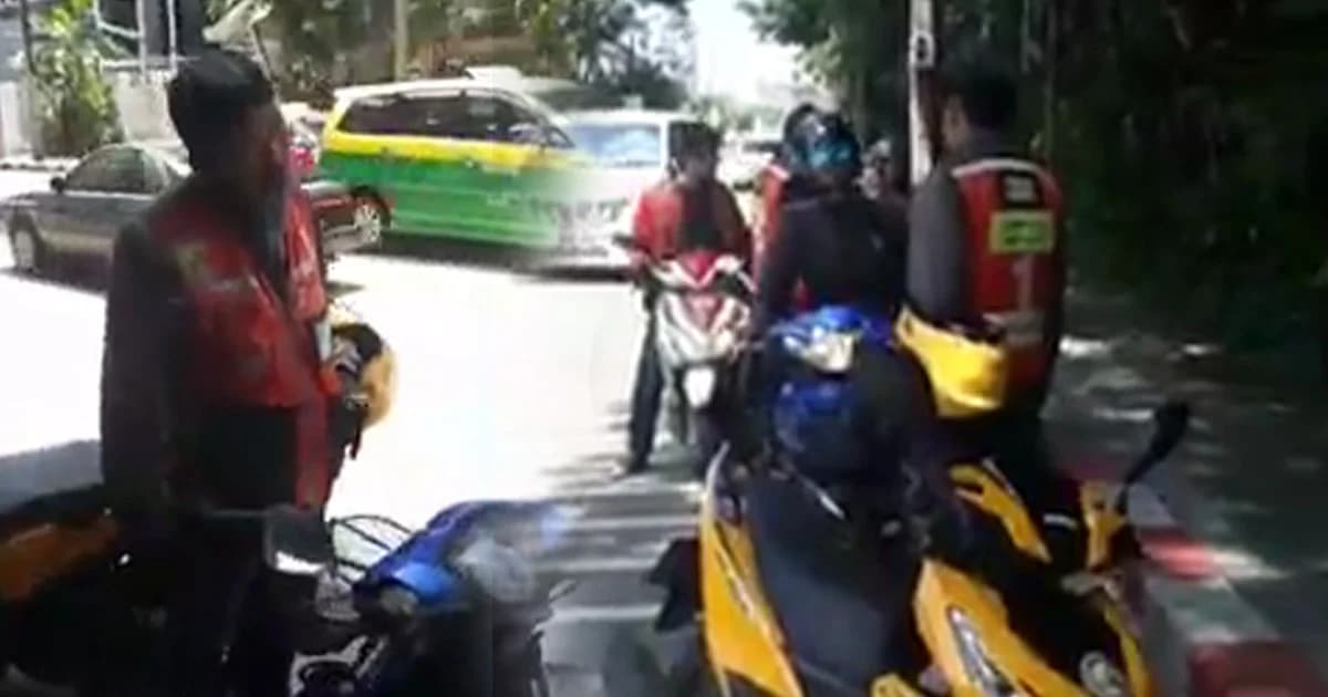 กลุ่มวิน จยย. ยืนล้อมแกร็บไบค์ ท้าต่อยตัวต่อตัว ไม่พอใจส่งคนในพื้นที่